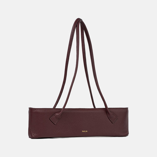 Bordowa skórzana torebka Teckelete o podłużnej formie z długimi uchwytami i złotym logo marki Taksuba