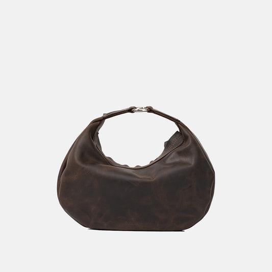 Ciemnobrązowa skórzana torebka Hedera marki Taksuba w wersji do ręki, z karabińczykiem na rączce i półokrągłym kształtem