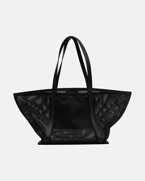 Front view of the black Astra Mesh shopper bag with wide sculptural shape and long shoulder handles