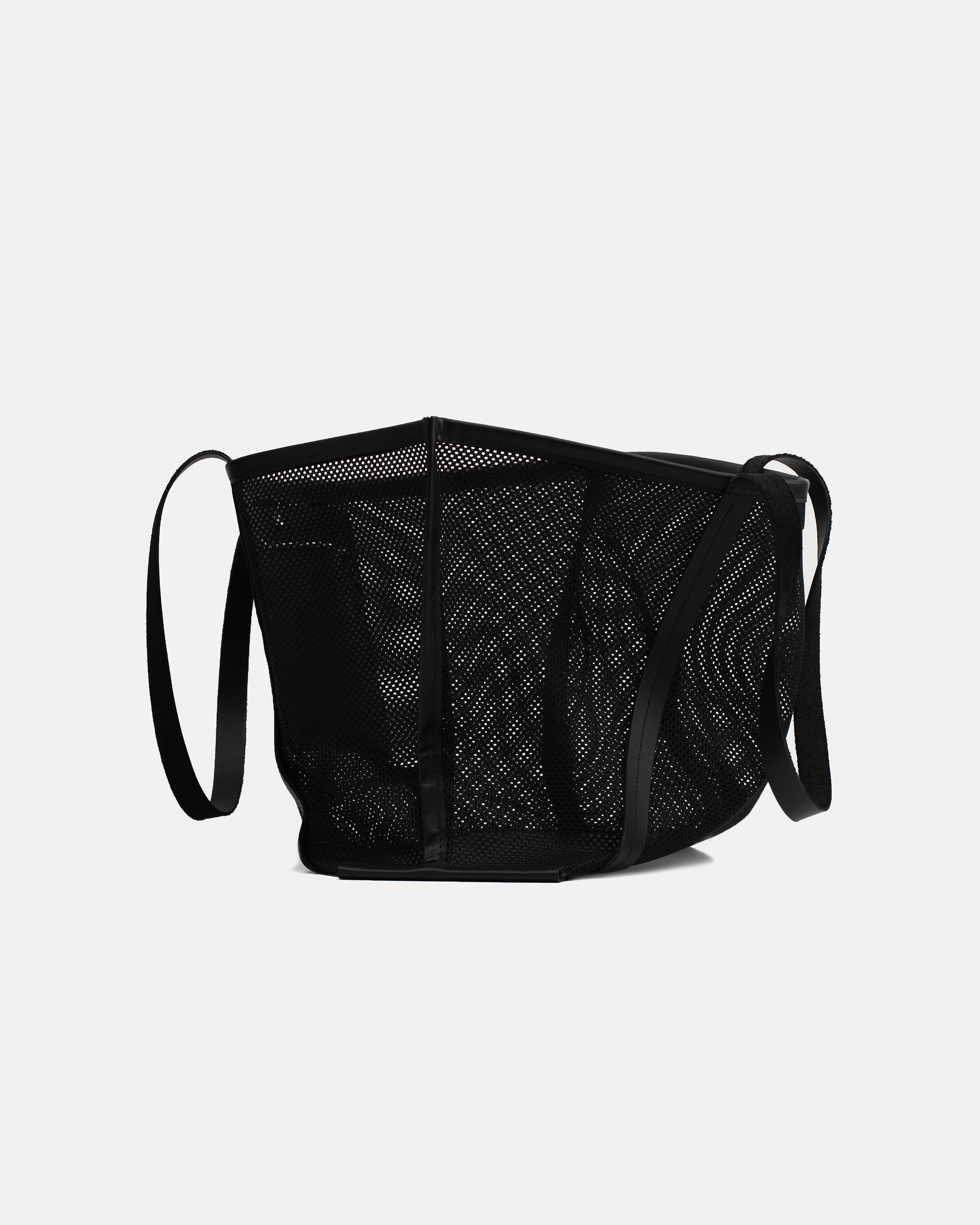 Side view of the black Astra Mesh shopper bag with semi-transparent mesh panels and structured edges