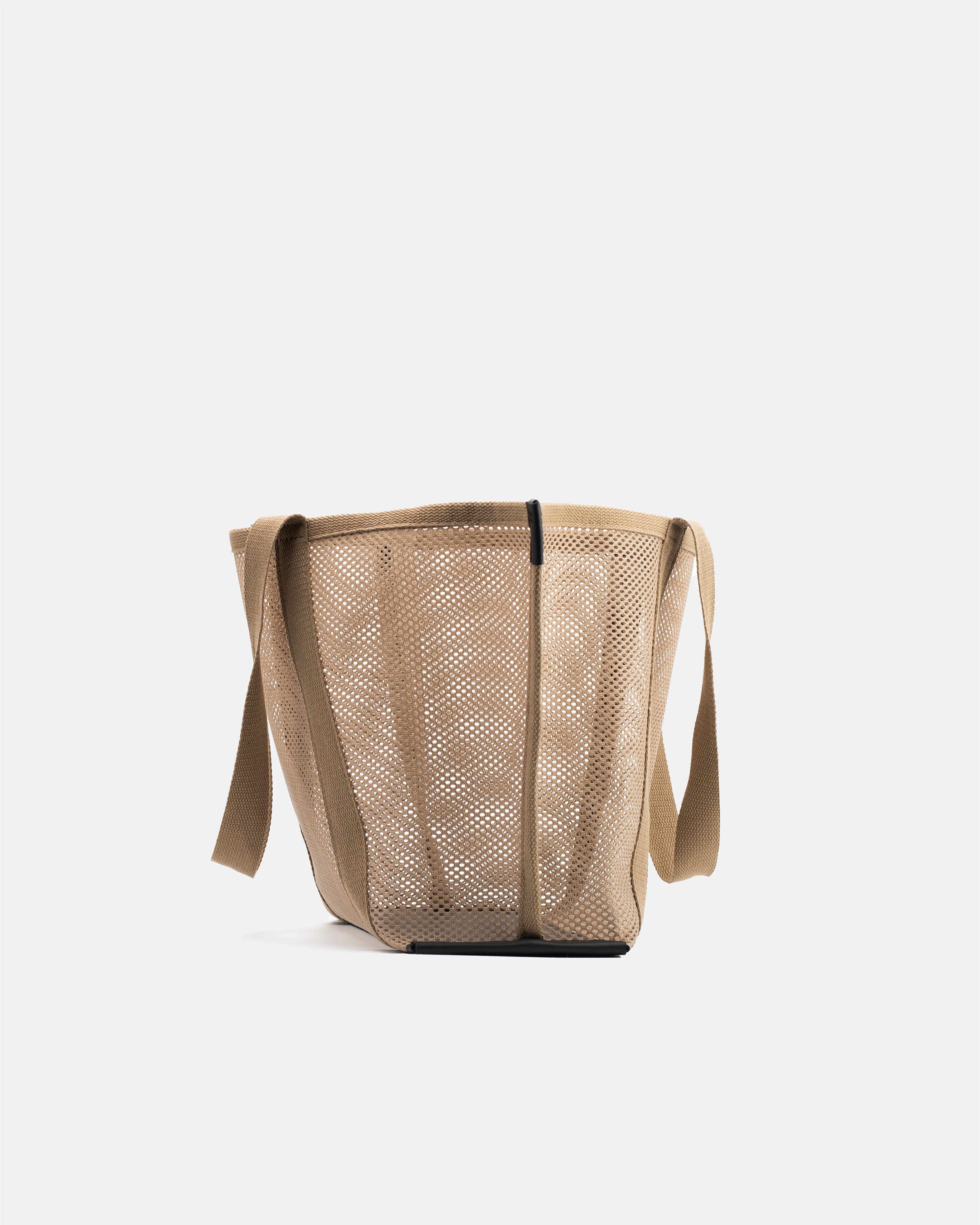 Side view of Astra Shopper Mesh beige tote bag with semi-transparent mesh body, shoulder straps, and structured leather base