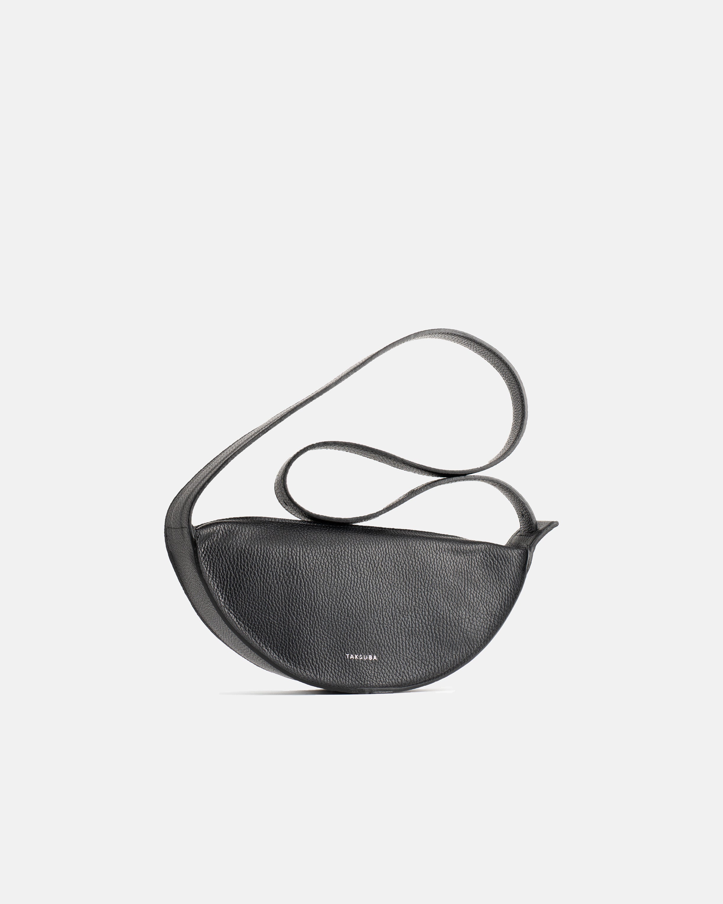Black Eclipse M leather handbag with crescent shape and shoulder strap arranged above