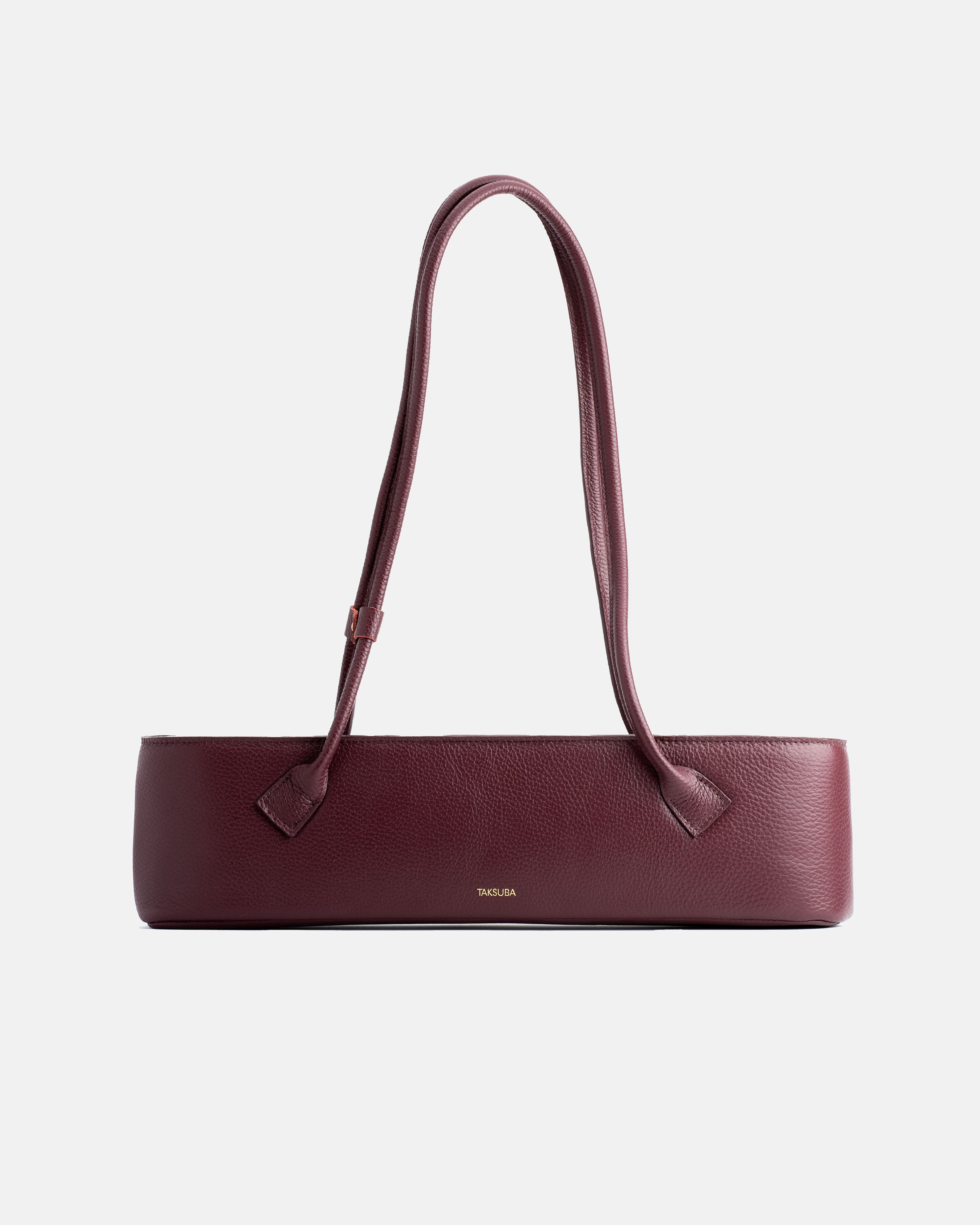 Bordowa skórzana torebka Teckelete na ramię, w wydłużonym poziomym fasonie