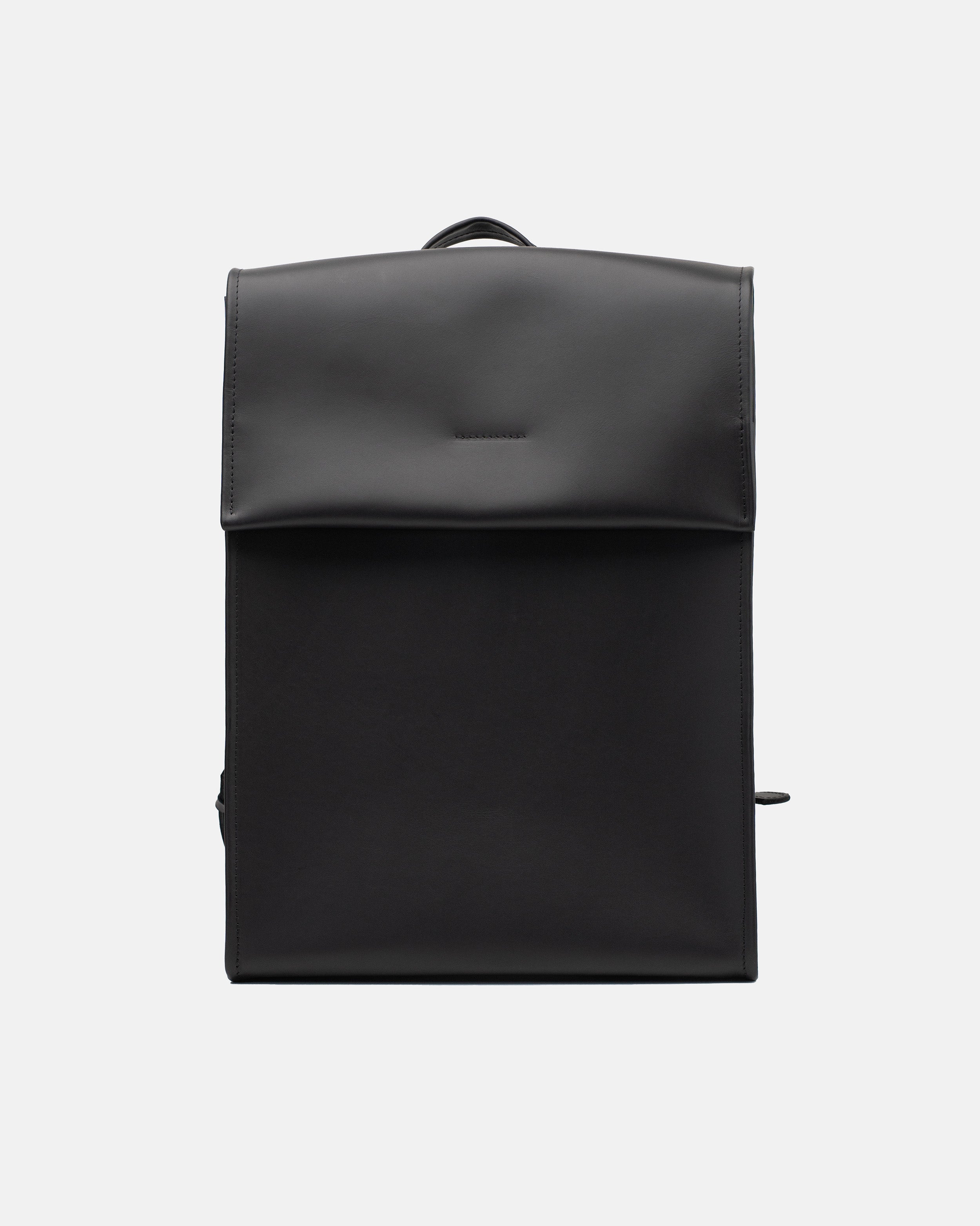 Large smooth black leather backpack with a clean front flap and structured rectangular shape