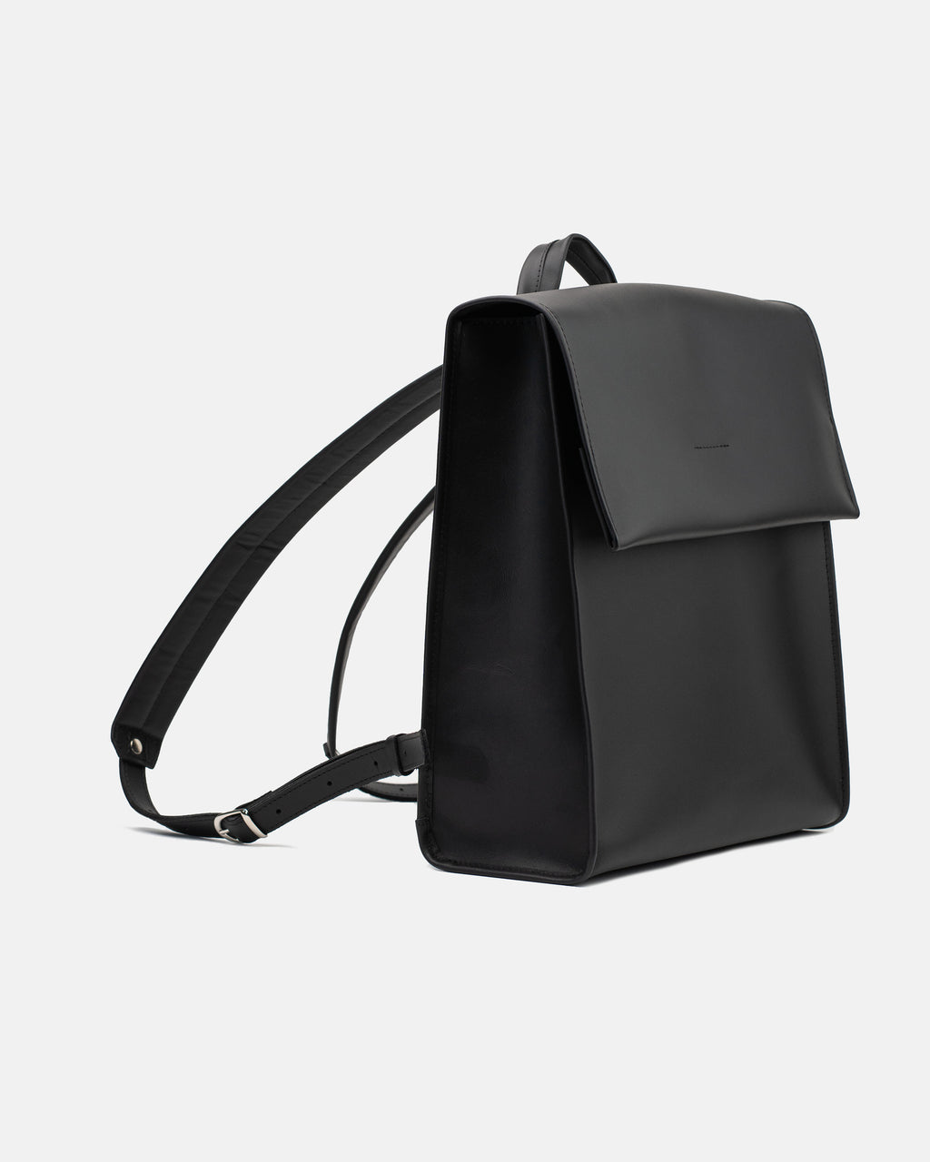 Medium smooth black leather backpack with a clean front flap and structured rectangular shape