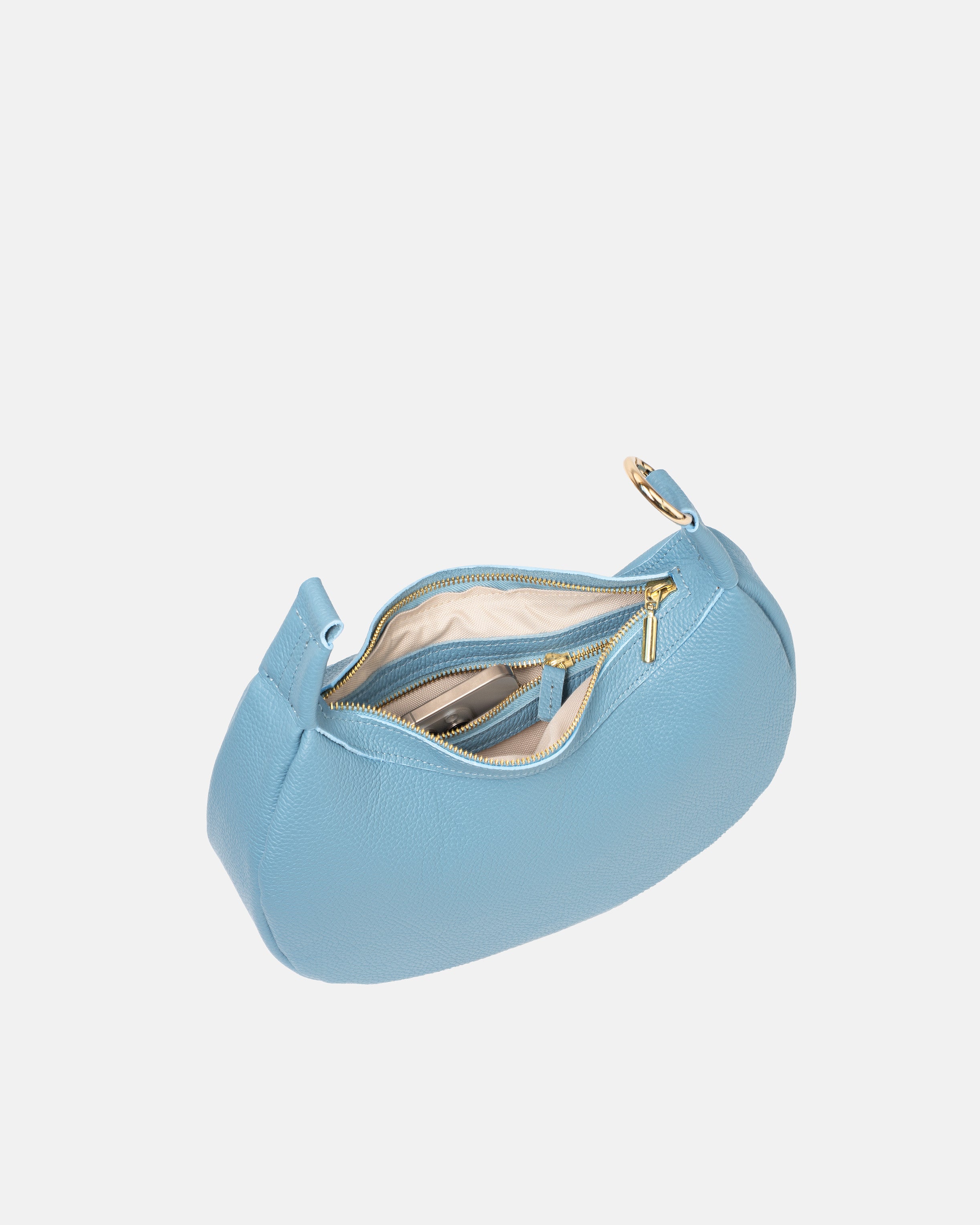 Wewnętrzny widok otwartej niebieskiej skórzanej torebki damskiej z metalowym zamkiem błyskawicznym, pokazujący przegrodę na telefon i dodatkowe kieszonki